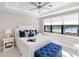 This main bedroom features a ceiling fan and a large window with a beautiful view of the water at 13137 Oriago St, Venice, FL 34293