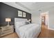 Cozy bedroom featuring a tray ceiling, neutral decor, and a mirrored nightstand at 1409 Remington Trace Dr, Port Charlotte, FL 33953