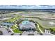 Aerial shot of the community clubhouse, pool, and recreational amenities at 1409 Remington Trace Dr, Port Charlotte, FL 33953