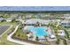 Aerial view of the community pool, clubhouse, and surrounding amenities at 1409 Remington Trace Dr, Port Charlotte, FL 33953