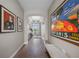 Inviting entryway with hardwood flooring, high ceilings, arched doorway, and decorative art at 1409 Remington Trace Dr, Port Charlotte, FL 33953