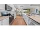 Well-equipped kitchen with stainless steel appliances, granite countertops, and ample cabinet space at 1409 Remington Trace Dr, Port Charlotte, FL 33953