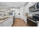 Modern kitchen featuring stainless steel appliances, granite countertops, and ample storage at 1409 Remington Trace Dr, Port Charlotte, FL 33953