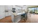 Stylish kitchen featuring stainless steel appliances, granite countertops, and a view of the outdoor dining space at 1409 Remington Trace Dr, Port Charlotte, FL 33953