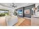 Comfortable living room featuring a modern ceiling fan and a statement wall with television at 1409 Remington Trace Dr, Port Charlotte, FL 33953