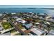 Aerial view of waterfront homes with private boat docks and canal access to the ocean at 1456 Deer Creek Dr, Englewood, FL 34223