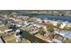 This waterfront home offers boating access, a well-manicured lawn, and mature trees for privacy at 1456 Deer Creek Dr, Englewood, FL 34223