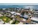 Aerial view of waterfront community with single-story homes, canals, and docks at 1456 Deer Creek Dr, Englewood, FL 34223
