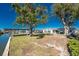 An expansive backyard leads down to a boat dock on the canal at 1456 Deer Creek Dr, Englewood, FL 34223