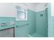 Retro mint tiled shower with window and built in seat ready for renovation at 1456 Deer Creek Dr, Englewood, FL 34223