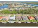 Waterfront homes, screened pools, and boat docks in a tropical landscaped neighborhood at 15578 Seafoam Cir, Port Charlotte, FL 33981