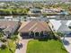 Overhead view of a single-story home in a waterfront community with a two-car garage at 15578 Seafoam Cir, Port Charlotte, FL 33981