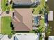 Aerial view of the house highlighting its lush landscaping, pool, and access to waterfront at 15578 Seafoam Cir, Port Charlotte, FL 33981