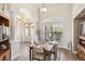 Dining room with views of the entry door and a large window at 15578 Seafoam Cir, Port Charlotte, FL 33981
