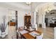 Open dining area featuring tile flooring, white walls, and a square table at 15578 Seafoam Cir, Port Charlotte, FL 33981