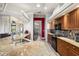 Gourmet kitchen with wooden cabinets, black appliances, and granite countertops at 15578 Seafoam Cir, Port Charlotte, FL 33981