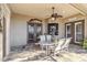 Screened patio with tile flooring, ceiling fan, and outdoor dining set at 15578 Seafoam Cir, Port Charlotte, FL 33981