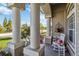 Charming front porch with comfortable seating, decorative plants, and stylish architectural details at 15578 Seafoam Cir, Port Charlotte, FL 33981