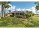 Screened-in lanai and lush tropical landscaping at 16137 Alcira Cir, Punta Gorda, FL 33955
