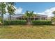 Backyard with privacy hedge and screened in lanai at 16137 Alcira Cir, Punta Gorda, FL 33955