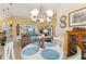 Bright dining room is adjacent to the living room and features plenty of natural light and chandelier lighting at 16137 Alcira Cir, Punta Gorda, FL 33955