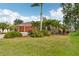 Attractive single-story home with a brick paved driveway and mature landscaping at 16137 Alcira Cir, Punta Gorda, FL 33955