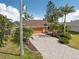A well manicured lawn and brick driveway at 16137 Alcira Cir, Punta Gorda, FL 33955
