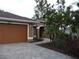 Inviting single-Gathering home showcasing a paver driveway and tropical landscaping at 16137 Alcira Cir, Punta Gorda, FL 33955