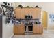 Modern kitchen features stainless steel appliances, ample cabinet space and flows openly into adjacent living spaces at 16137 Alcira Cir, Punta Gorda, FL 33955