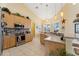 Well-equipped kitchen features stainless steel appliances, tile flooring, and a functional layout for cooking at 16137 Alcira Cir, Punta Gorda, FL 33955