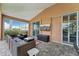 Covered lanai featuring comfortable wicker seating and a flatscreen television at 16137 Alcira Cir, Punta Gorda, FL 33955