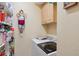 Bright laundry room featuring a modern washer and dryer, and ample pantry storage shelves at 16137 Alcira Cir, Punta Gorda, FL 33955