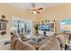 This comfortable living room features vaulted ceilings, a large sectional couch, and a bright, airy atmosphere at 16137 Alcira Cir, Punta Gorda, FL 33955