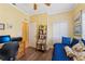 Office space with a desk, bookshelf, and daybed that is well-lit and features hard wood floors at 16137 Alcira Cir, Punta Gorda, FL 33955