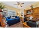 Functional home office featuring wood floors, desk space, and a comfortable daybed, ideal for productivity at 16137 Alcira Cir, Punta Gorda, FL 33955