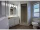 Bathroom featuring walk-in shower, vanity with sink, and toilet at 192 Garden Nw Ave, Port Charlotte, FL 33952