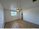 Bright bedroom featuring wood-look floors and a ceiling fan, offering a comfortable space at 192 Garden Nw Ave, Port Charlotte, FL 33952