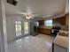 Open kitchen featuring stainless steel appliances, tile floors, and a ceiling fan at 192 Garden Nw Ave, Port Charlotte, FL 33952
