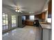 Open kitchen featuring stainless steel appliances, tile floors, and double doors at 192 Garden Nw Ave, Port Charlotte, FL 33952