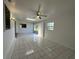 Living room boasts tile flooring, skylight and ceiling fan at 192 Garden Nw Ave, Port Charlotte, FL 33952