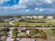 Aerial view of property showing the surrounding community and marked with red boundary lines at 2191 Williamsburg Way, Englewood, FL 34224