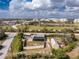 Aerial view of property with pond and landscaping, showcasing community at 2191 Williamsburg Way, Englewood, FL 34224