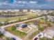 Aerial view of a property with solar panels, fenced yard and detached garage with a red boundary line at 2191 Williamsburg Way, Englewood, FL 34224