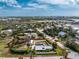 Coastal community view with home, garage, fenced yard, lush foliage, and marked property line at 2191 Williamsburg Way, Englewood, FL 34224