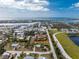 Aerial view showing the property location near coastal waterways and community pond at 2191 Williamsburg Way, Englewood, FL 34224