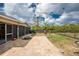 Paver patio, perfect for grilling and relaxing, with views of the backyard at 2191 Williamsburg Way, Englewood, FL 34224