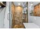 Contemporary shower with glass enclosure, mosaic tile accents, and convenient shelving at 2191 Williamsburg Way, Englewood, FL 34224