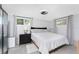 Serene bedroom with soft lighting, neutral tones, and comfortable furnishings for a relaxing retreat at 2191 Williamsburg Way, Englewood, FL 34224