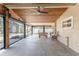 Enclosed area with wood ceiling, ceiling fan, and sliding doors leading to the outdoors at 2191 Williamsburg Way, Englewood, FL 34224