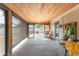 Covered outdoor area featuring wood ceiling, a screened-in portion, and ample space at 2191 Williamsburg Way, Englewood, FL 34224